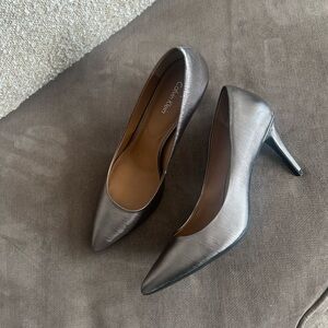 Beautiful pair of ‘barely worn’ Calvin Klein Silver 3” Women’s Heels.